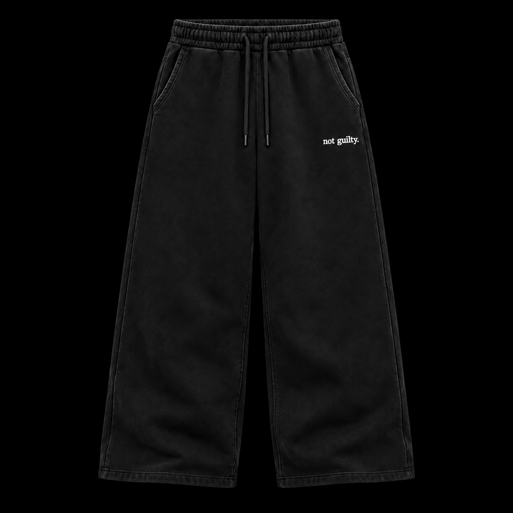 not guilty. Signature Sweatpants black baggy on black background
